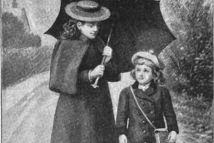 Two children walking along a wet road, one holding an open umbrella, both wearing coats and hats.