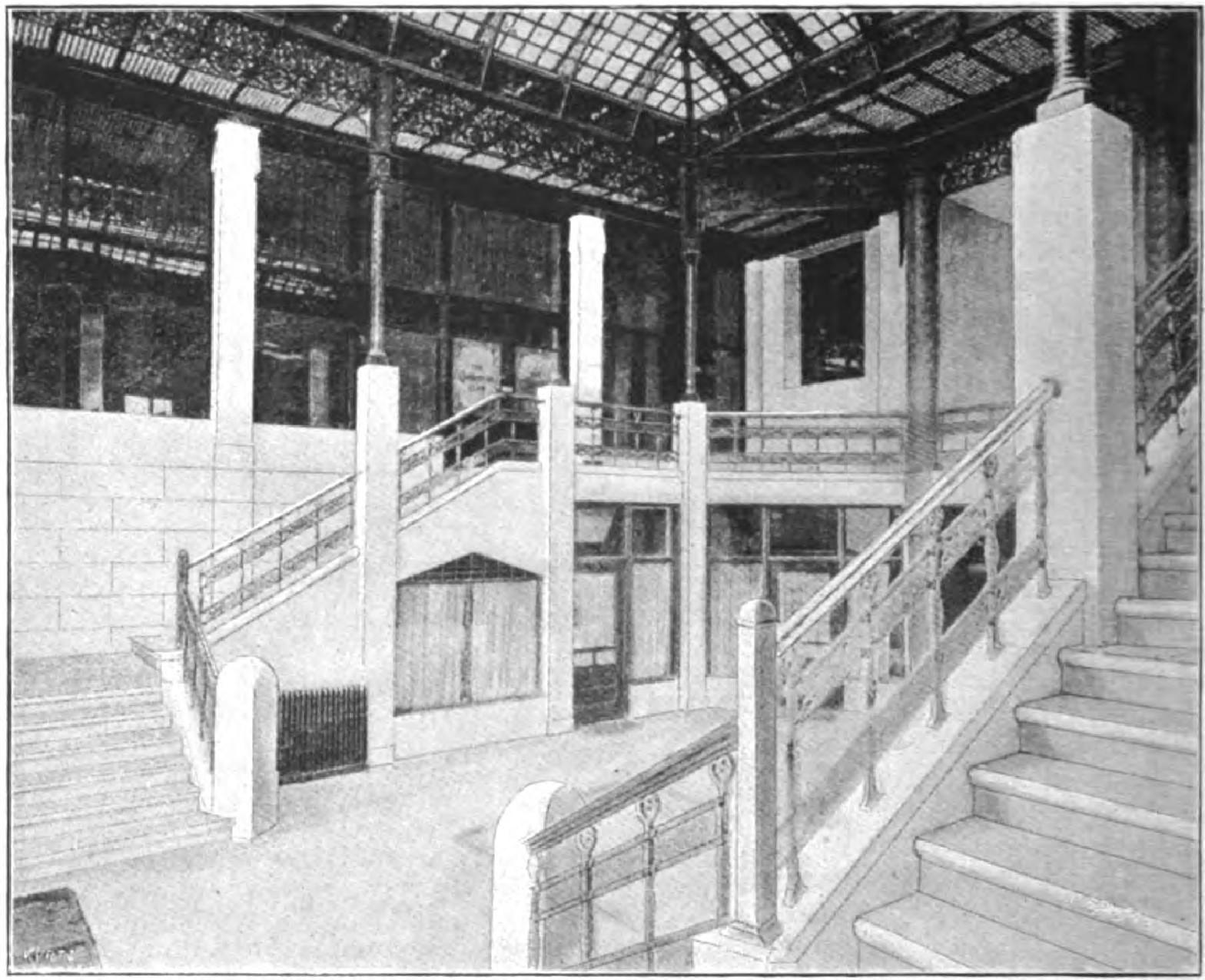 Ornate building interior with marble staircases and decorative columns