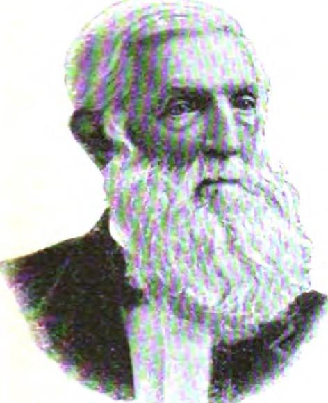 Elderly man with white beard in formal attire