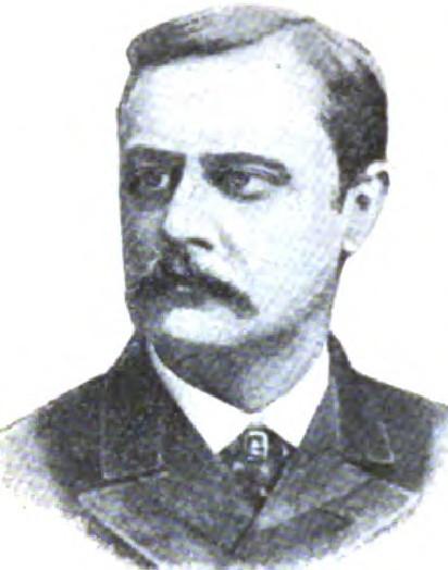 Man with dark hair and and mustache