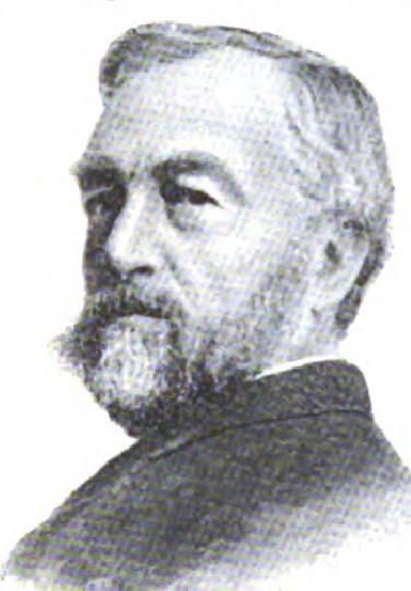 Older man with gray hair and beard in formal attire