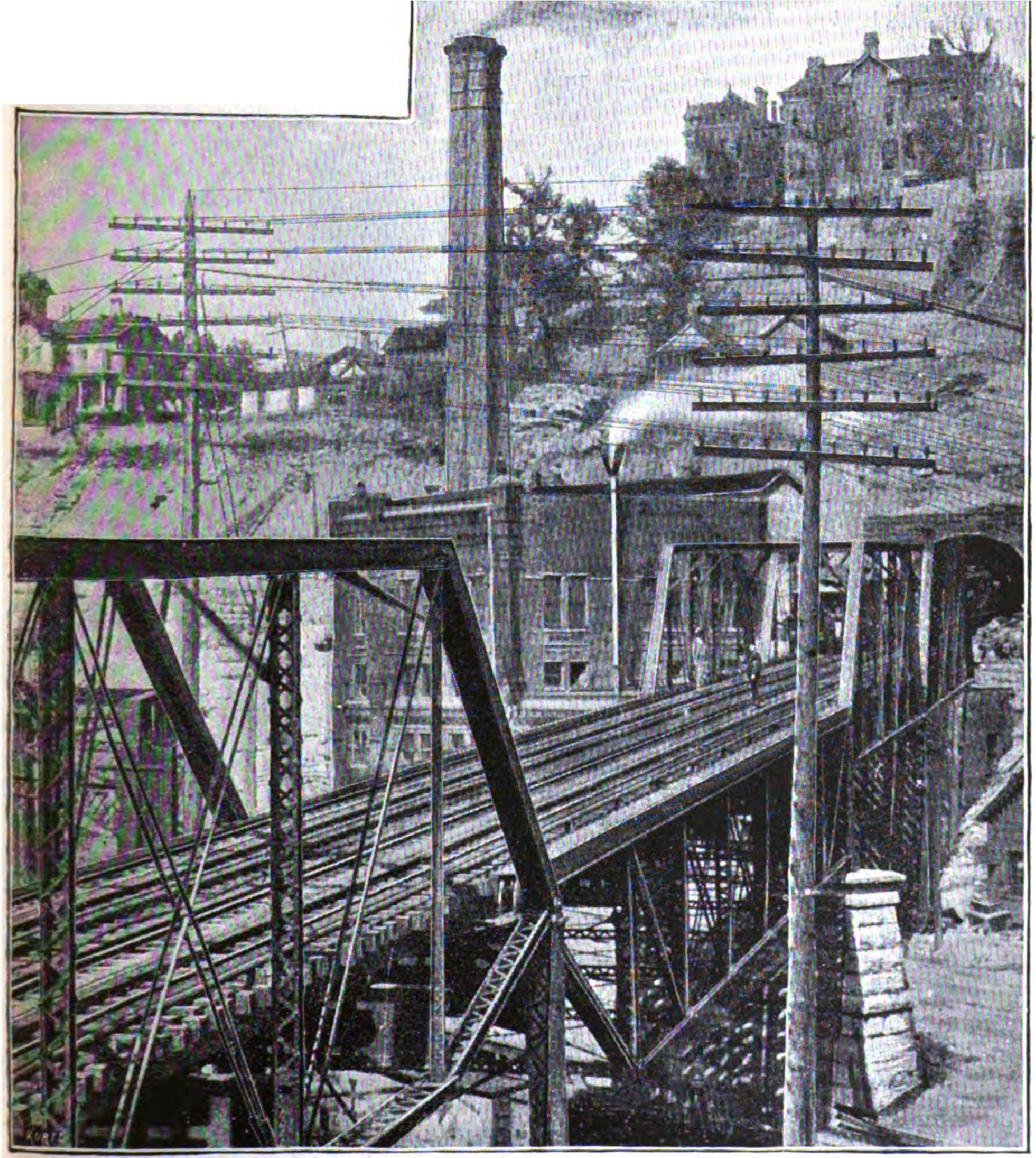 Iron railway bridge with multiple truss supports spanning water