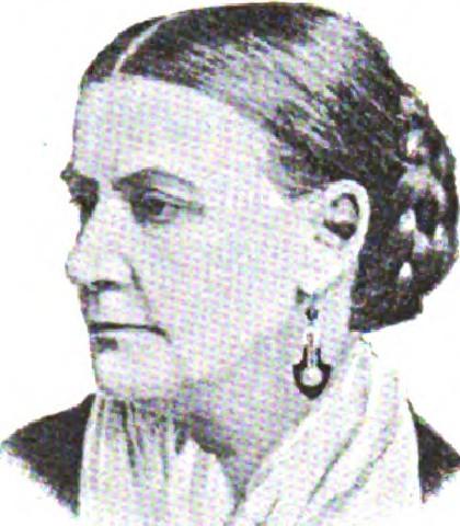 Woman in profile wearing Victorian dress with updo hairstyle