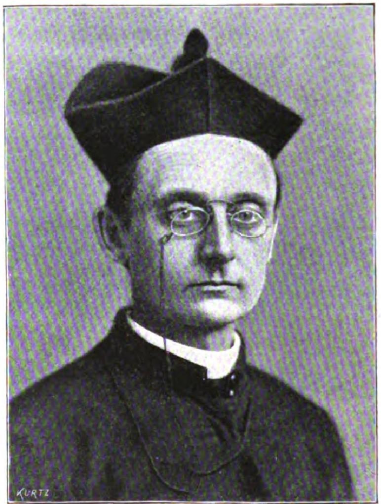 Portrait of man in clerical collar wearing biretta cap and spectacles