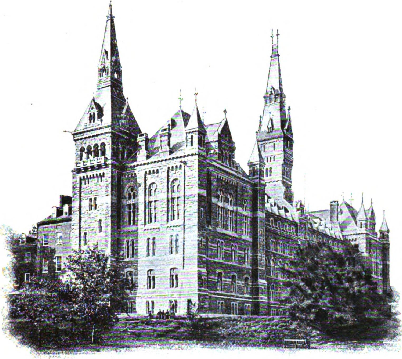 Large stone university building with multiple towers and Romanesque architectural features